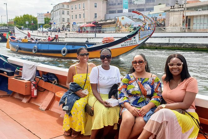 Aveiro Small Group Tour with Typical Boat Ride, offer wine bottle - Praia da Barra and Costa Nova: Farol da Barra and striped-house photo time