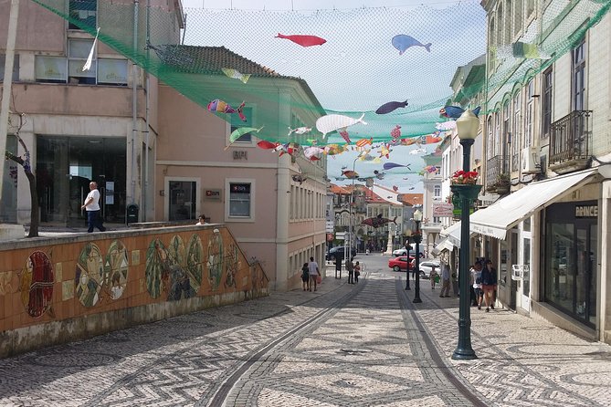 Aveiro Small Group Tour with Typical Boat Ride, offer wine bottle - Walking Aveiro for two hours and tasting ovos-moles at the monument