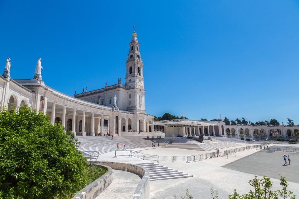 From Porto: Private Transfer to Lisbon with Coimbra & Fatima - Crossing the river and the Santa Clara Convent moment