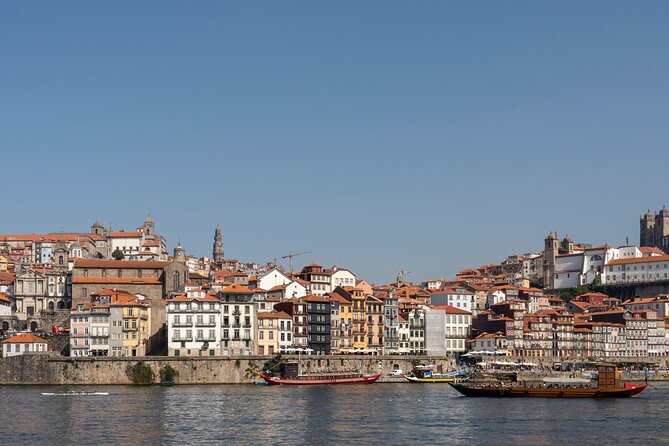 Porto 360°: Helicopter Flight, Guided Walking Tour & River Cruise - Douro River Cruise: Peaceful Water Views, and Why Headphones Help