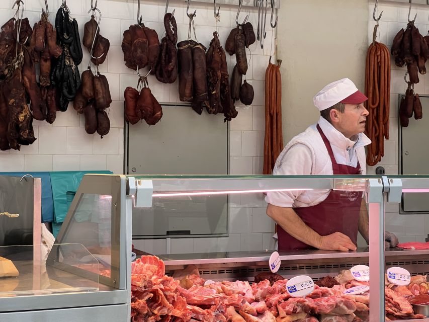 Porto: Bolhão Market Guided Food Tour - Inside the market: Vinho Verde, sardines, cheese, and cured meats