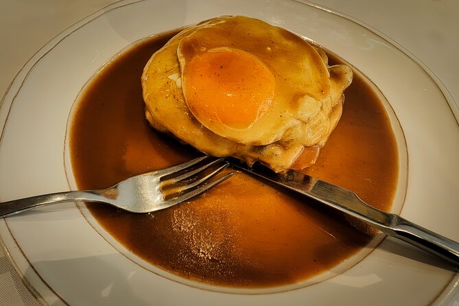 Porto Food Tour: 10 tastings at 5 restaurants & eateries - Carmo and Carmelitas churches, student cafés, and roasted chorizo