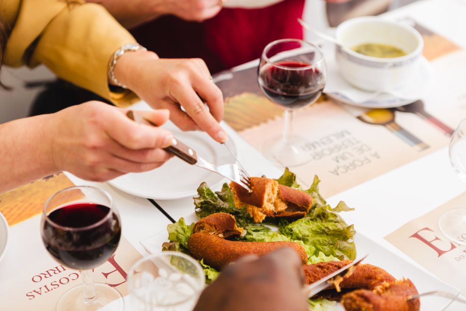 Porto: Food & Wine Tasting Walking Tour with Port Wine Cave - Price and value: $110 for 4 hours of food, cellar access, and walking