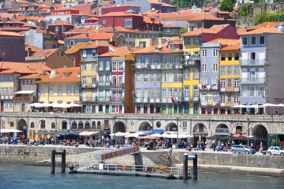 Porto Private Tour - Highlights and Tram Tickets - Walking Through the Historic Center Toward Ribeira