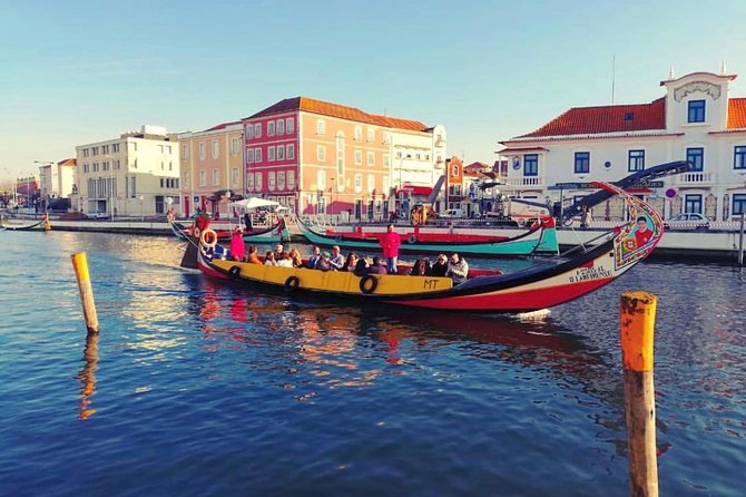 Private transfer from Oporto to Lisbon or Lisbon to Oporto - Aveiro Break: Canals, Moliceiro Boats, and Ovosmoles