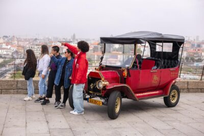 Tour Porto: Classic Adventure in Electric Tuk Tuk - Ribeira in an electric classic style: narrow streets, river views