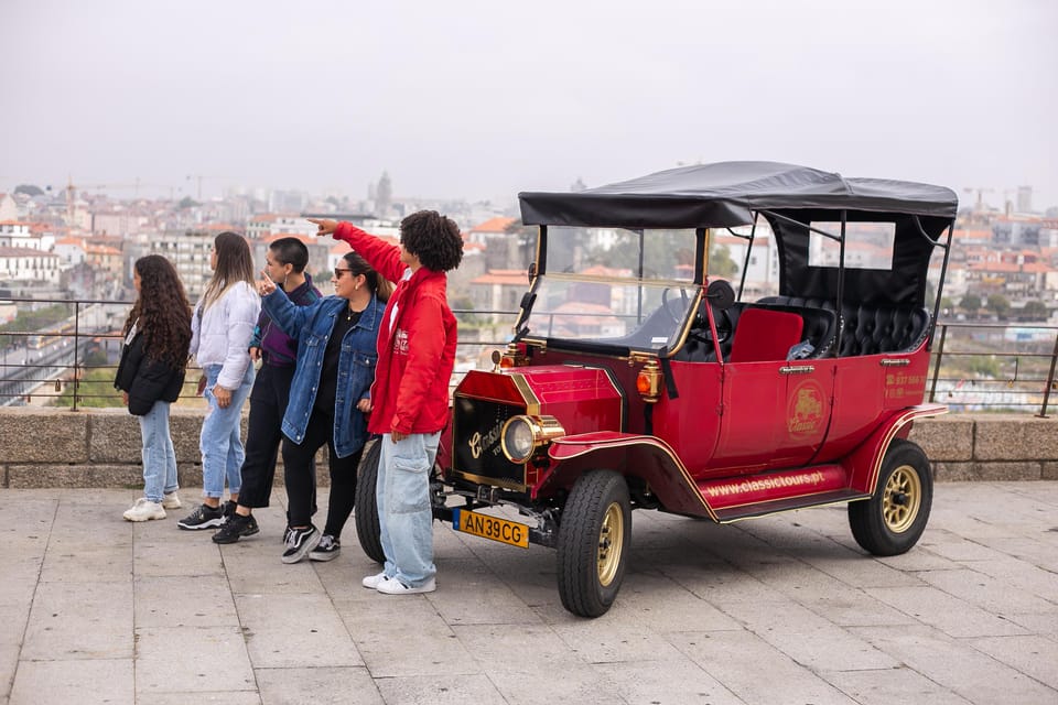 Tour Porto: Classic Adventure in Electric Tuk Tuk - Ribeira in an electric classic style: narrow streets, river views