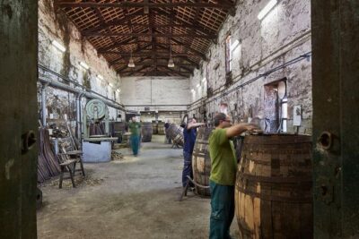 Visit Cockburn's cantine - Step inside the aging warehouse with 6,518 hulls overhead
